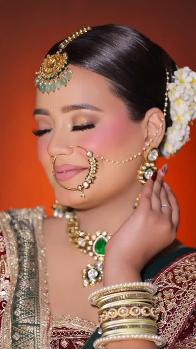 Bridal makeup close-up with nath and kundan jewelry, done at our salon