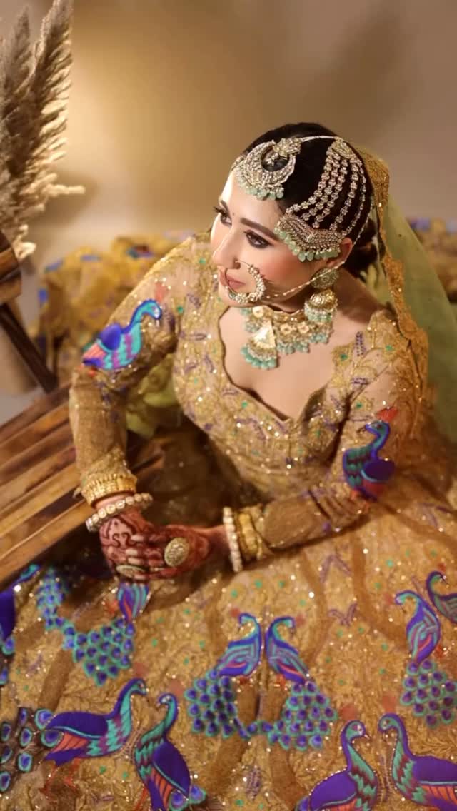 Real bride in a gold embroidered lehenga, complete look by Brideocity by Tuba