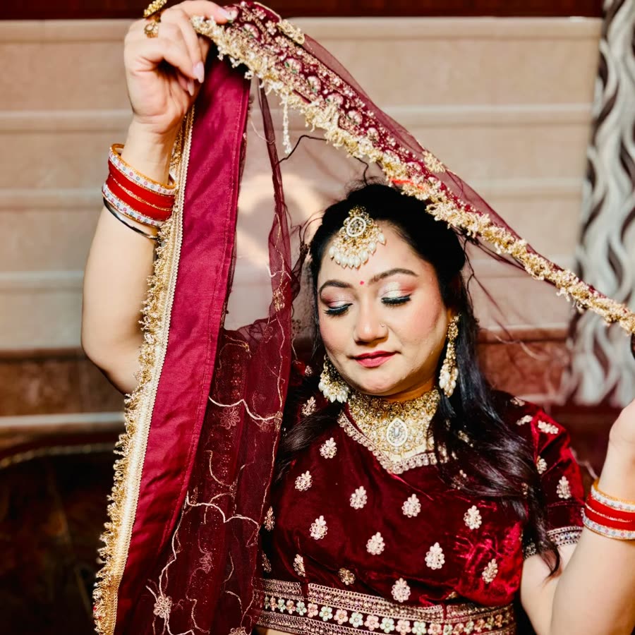 Real bride in a maroon velvet lehenga, makeup and styling by Brideocity by Tuba