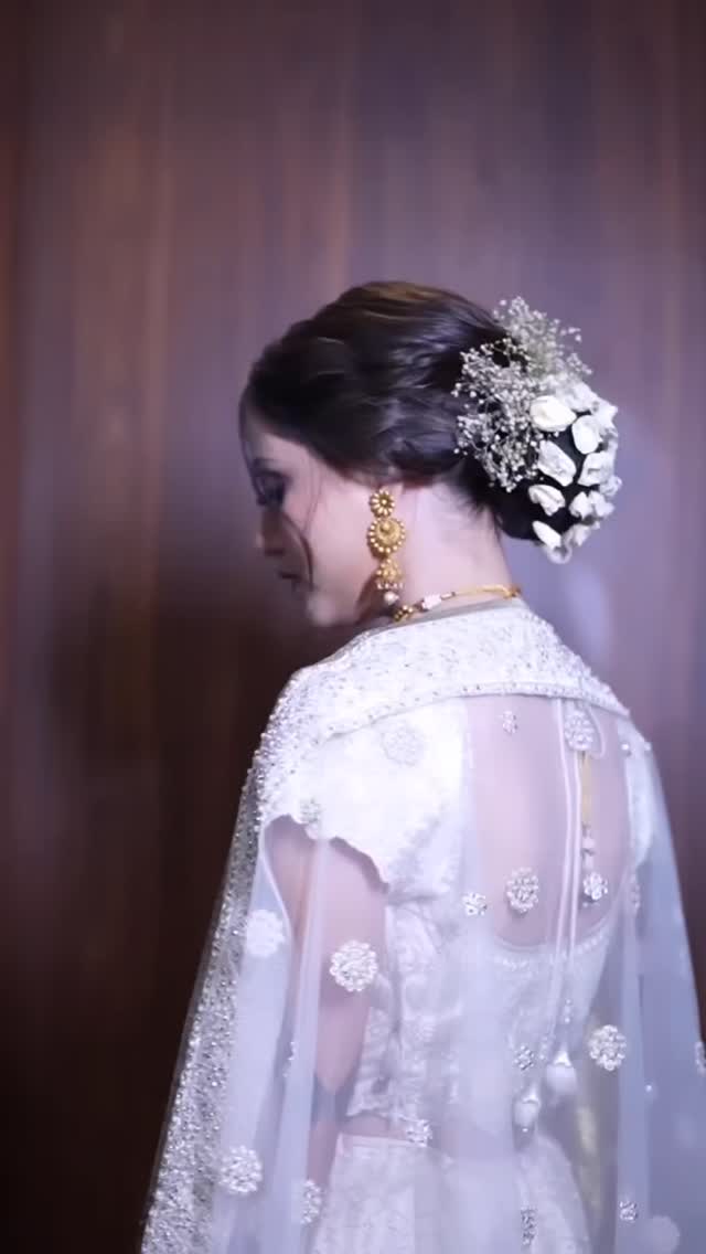 Elegant bridal updo with hair accessories, styled by Tuba