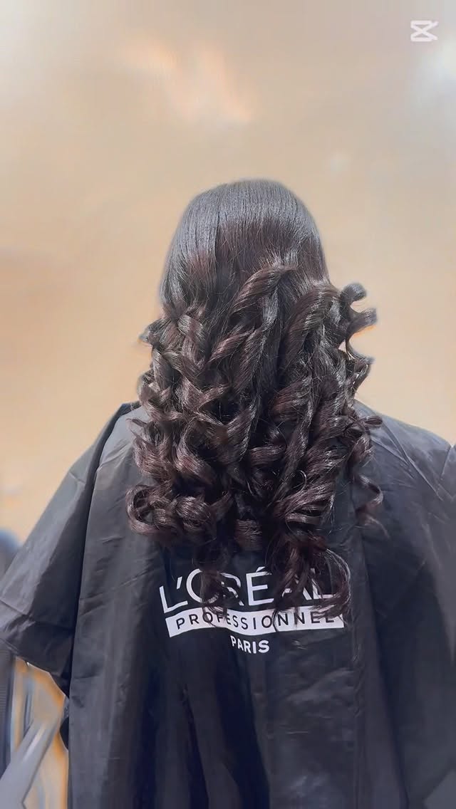 Bouncy barrel curls styled at our salon
